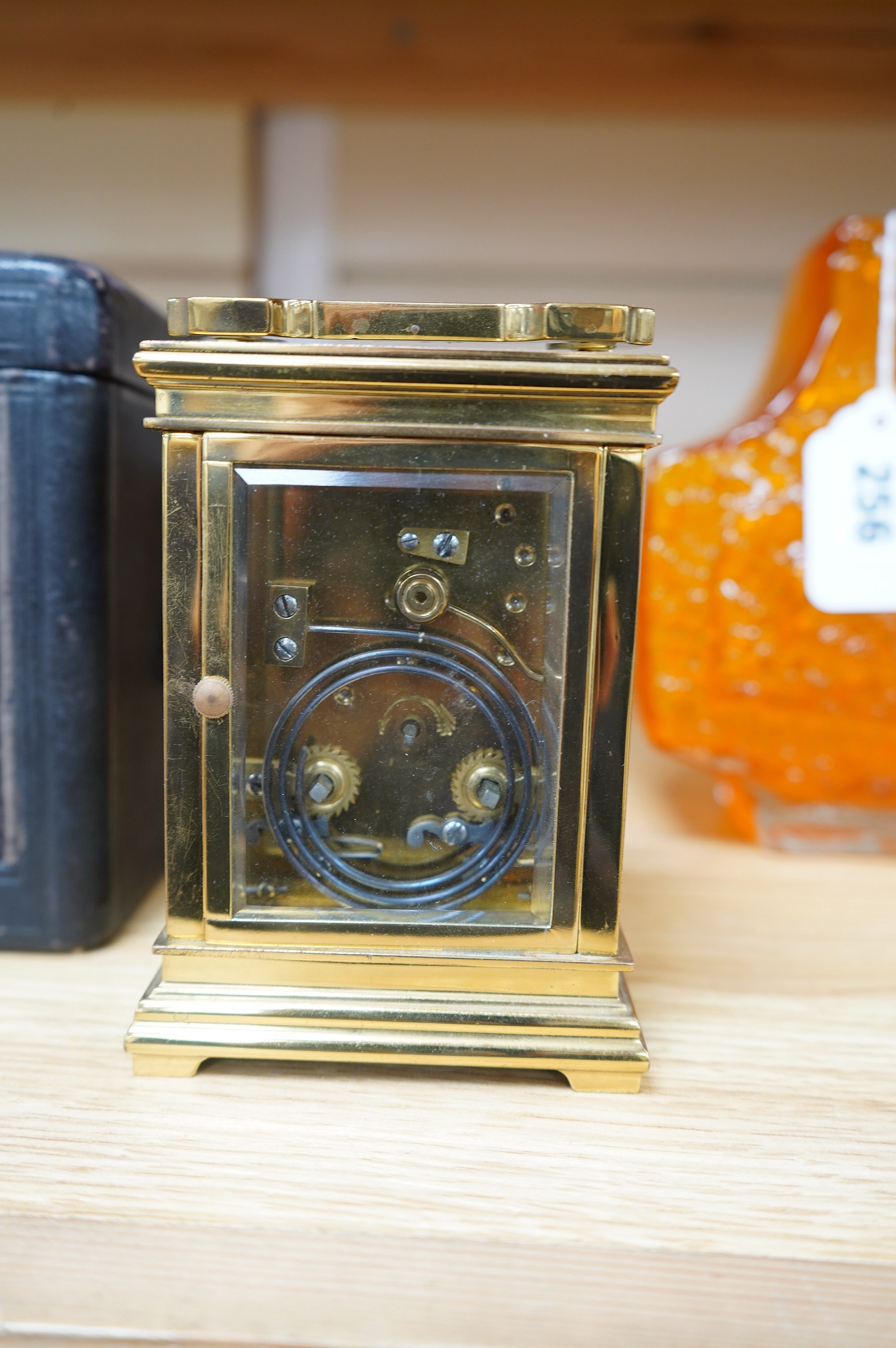 A late 19th century French brass cased eight day repeating carriage clock, Wilson & Sharp, in leather case. Condition - fair, not tested